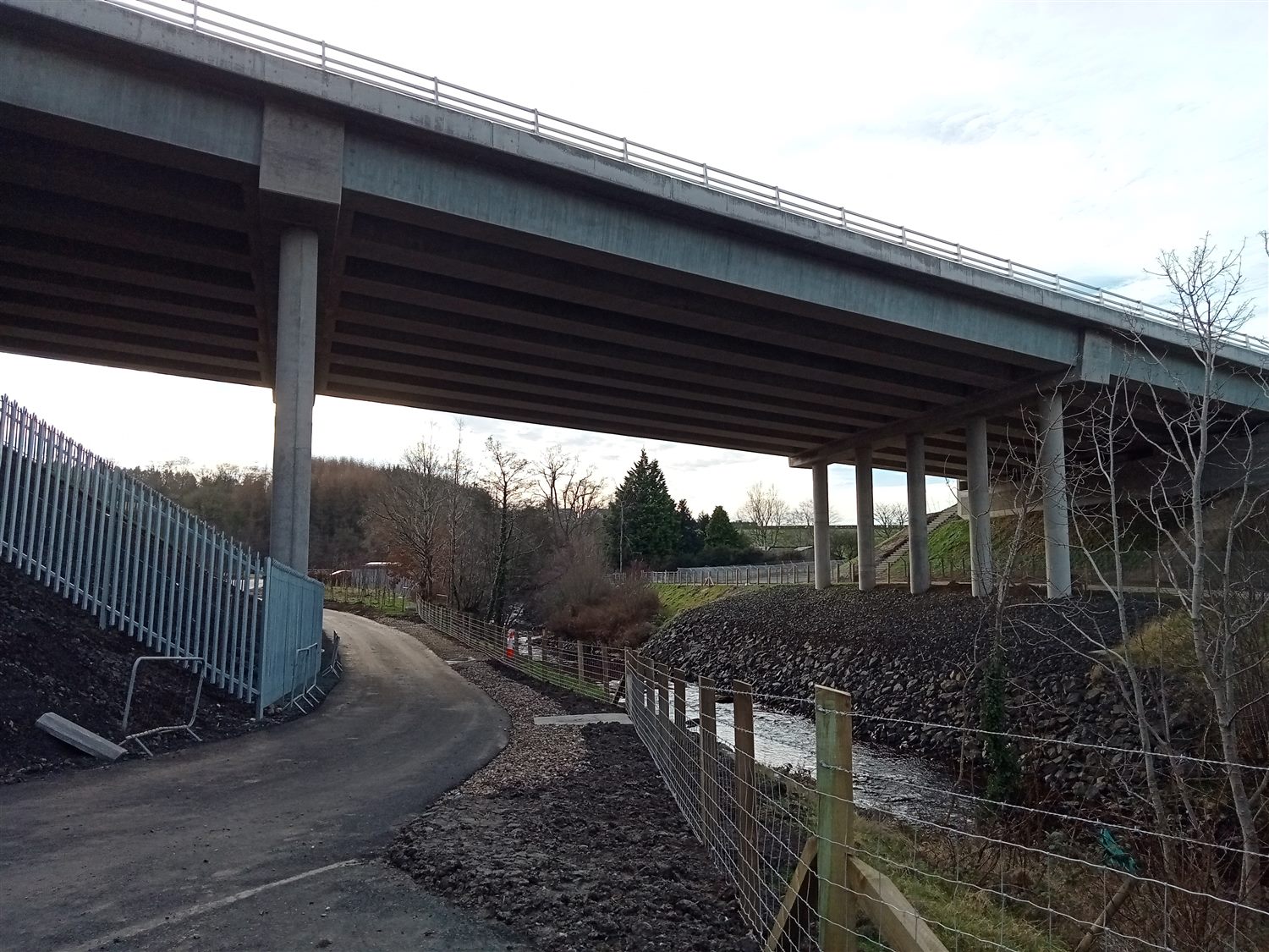 Concrete road bridge structure carrying a new bypass over a river valley